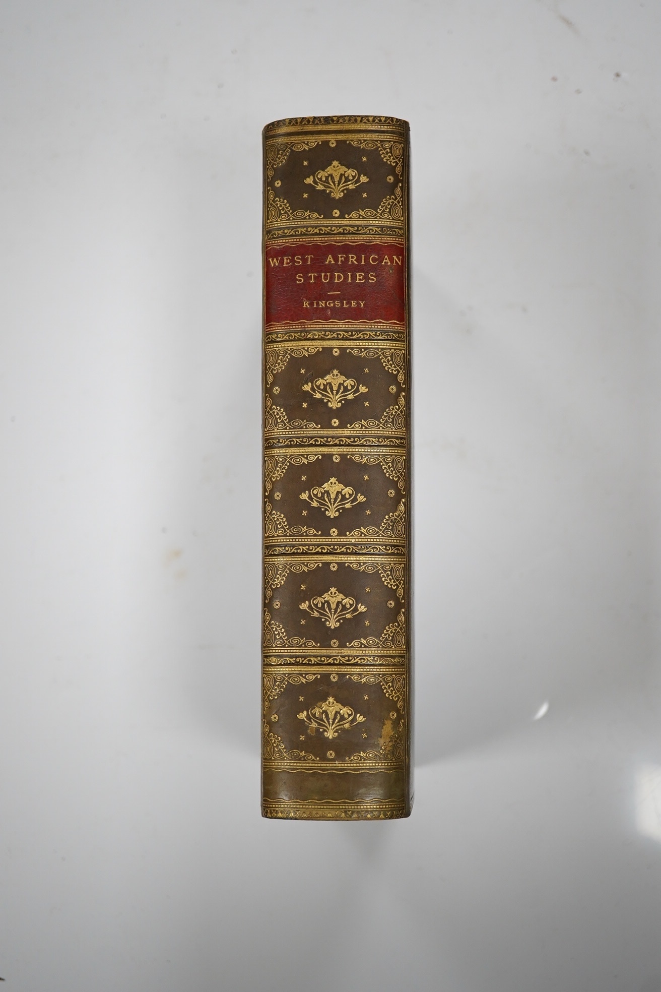 Kingsley, Mary - West African Studies. 24 photo plates, 2 folded, coloured maps; near contemp. gilt ruled green calf prize binding with gilt armorial on upper cover, gilt decorated and panelled spine with red label, marb